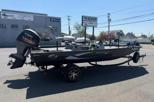 The Image of 2021 G3 Sportsman 1810 boat with Yamaha motor on trailer in parking lot. - 2