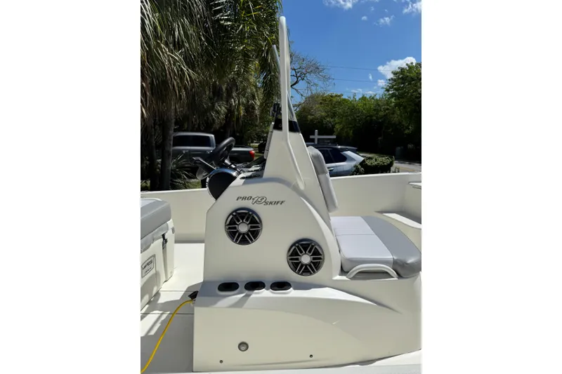 Slide: The Image of 2025 Mako Pro Skiff 19 CC boat interior with seating and speaker system. - 3