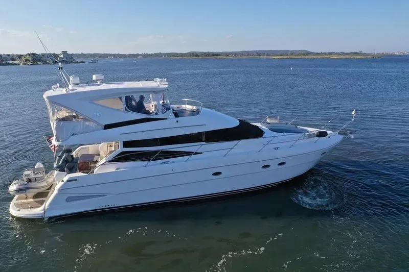 Slide: The Image of 2005 Neptunus 56 Flybridge yacht cruising on calm waters. - 17