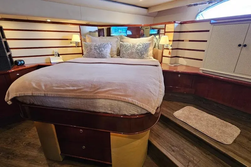 Slide: The Image of Luxurious bedroom interior of 2005 Neptunus 56 Flybridge yacht with elegant bedding. - 22
