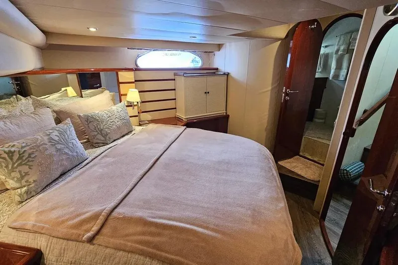 Slide: The Image of Luxurious bedroom interior of 2005 Neptunus 56 Flybridge yacht with cozy bedding and elegant decor. - 25