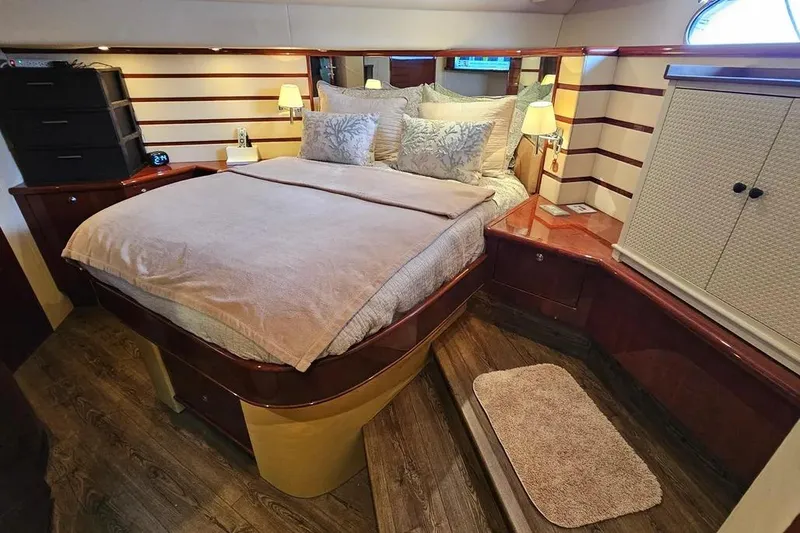Slide: The Image of Luxurious bedroom interior of 2005 Neptunus 56 Flybridge yacht with elegant wood finishes. - 26