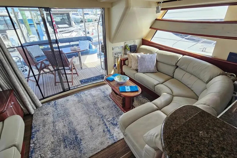 Slide: The Image of Luxurious interior of 2005 Neptunus 56 Flybridge yacht with plush seating and elegant decor. - 30