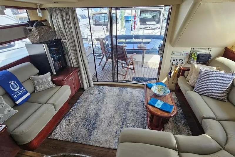 Slide: The Image of Luxurious interior of 2005 Neptunus 56 Flybridge yacht with elegant seating and decor. - 32
