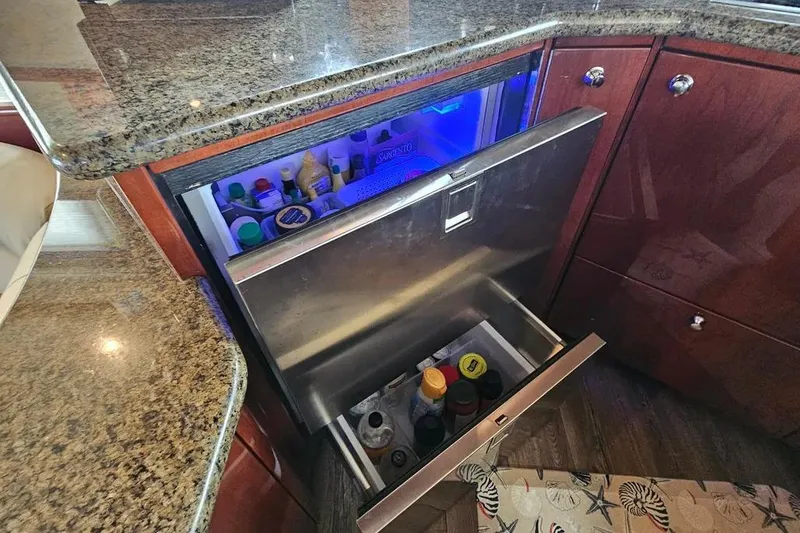 Slide: The Image of Luxury yacht Neptunus 56 Flybridge 2005 kitchen with open stainless steel refrigerator drawer. - 38