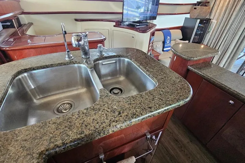 Slide: The Image of Luxurious kitchen area on a 2005 Neptunus 56 Flybridge yacht with granite countertops. - 39