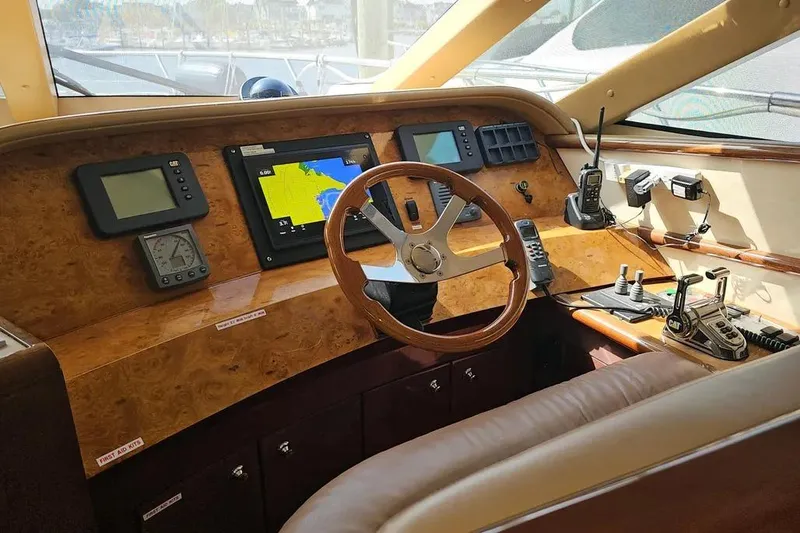 Slide: The Image of Cockpit of 2005 Neptunus 56 Flybridge yacht with navigation equipment and steering wheel. - 43
