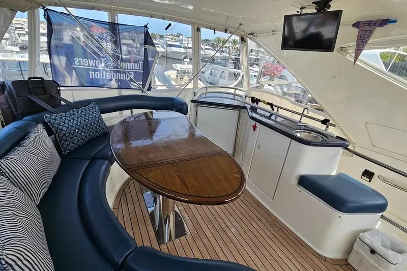Slide: The Image of Luxurious 2005 Neptunus 56 Flybridge interior with elegant seating and modern amenities. - 56