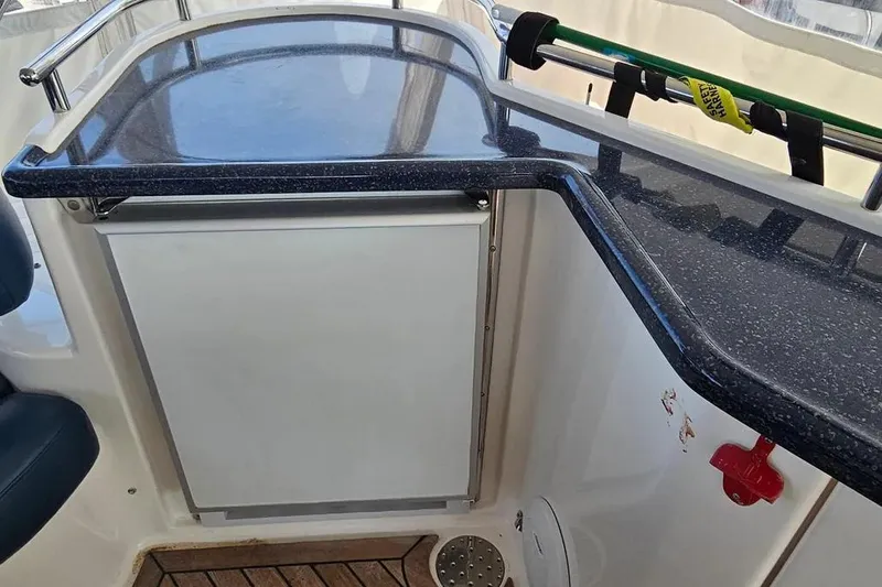 Slide: The Image of 2005 Neptunus 56 Flybridge yacht interior with sleek countertop and safety equipment. - 58
