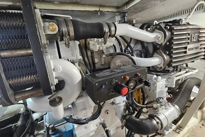 Slide: The Image of Engine room of 2005 Neptunus 56 Flybridge yacht, featuring CAT marine power components. - 63