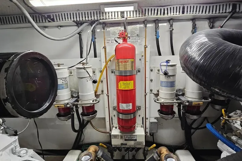 Slide: The Image of Engine room of 2005 Neptunus 56 Flybridge with fire extinguisher and filtration system. - 65