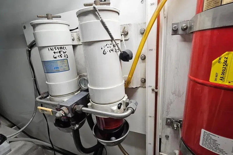 Slide: The Image of Engine room of 2005 Neptunus 56 Flybridge with fuel filters and fire extinguisher. - 66