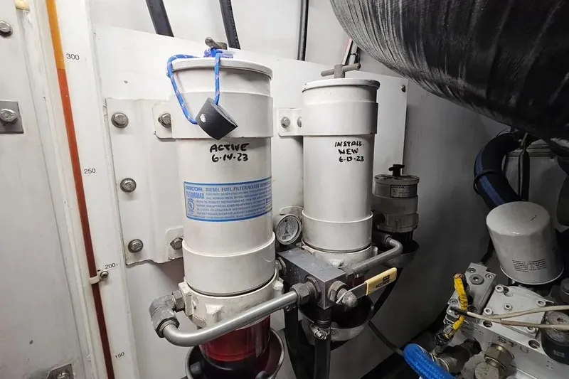Slide: The Image of Engine room of 2005 Neptunus 56 Flybridge with diesel fuel filters dated June 2023. - 67