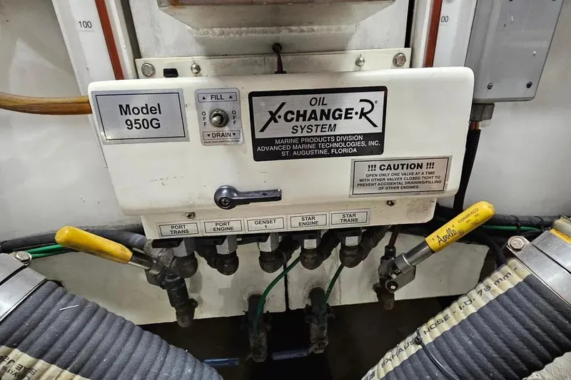 Slide: The Image of Oil X-Change-R system on 2005 Neptunus 56 Flybridge, Model 950G, with labeled valves. - 68