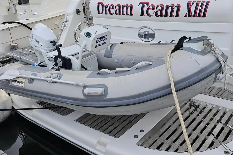 Slide: The Image of Inflatable dinghy on Neptunus 56 Flybridge yacht, 2005 model, with Tohatsu motor. - 76