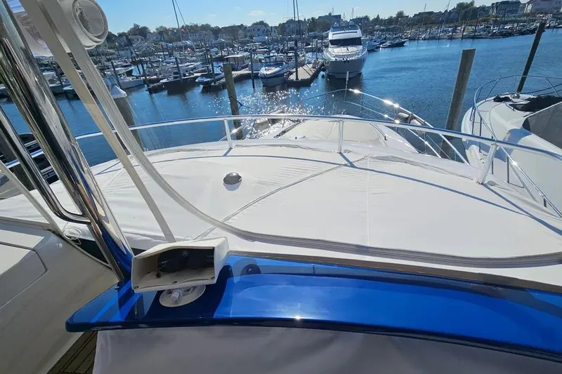 Slide: The Image of 2005 Neptunus 56 Flybridge yacht docked at marina, sunny day, sparkling water. - 77