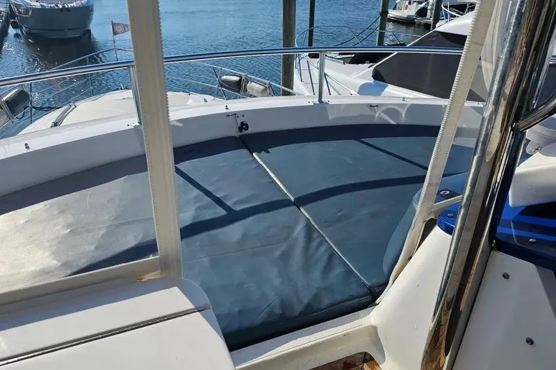 Slide: The Image of 2005 Neptunus 56 Flybridge yacht with sun deck, docked at marina. - 9