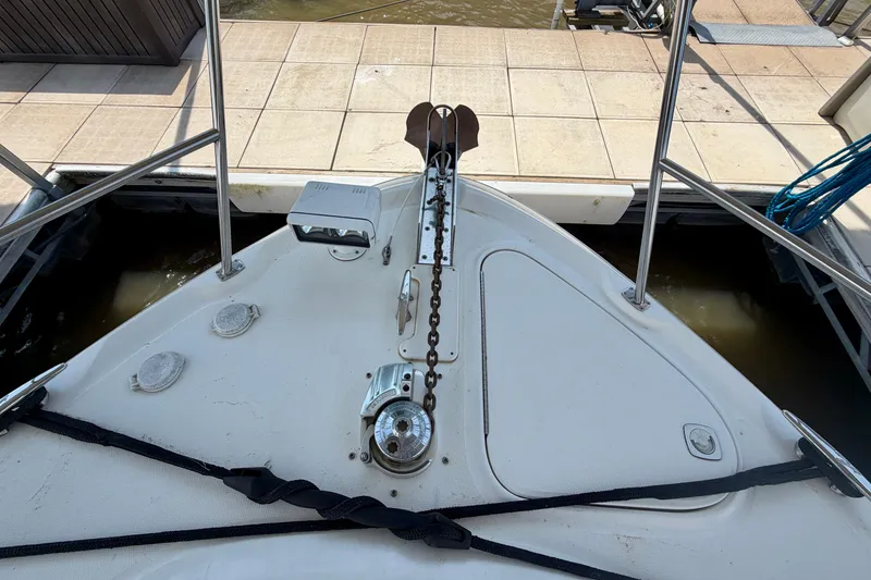 Slide: The Image of Bow of 2001 Sea Ray 410 Sundancer with anchor chain and dock view. - 21