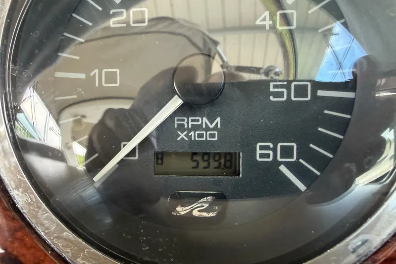 Slide: The Image of Close-up of a 2001 Sea Ray 410 Sundancer tachometer showing 599.8 RPM. - 23