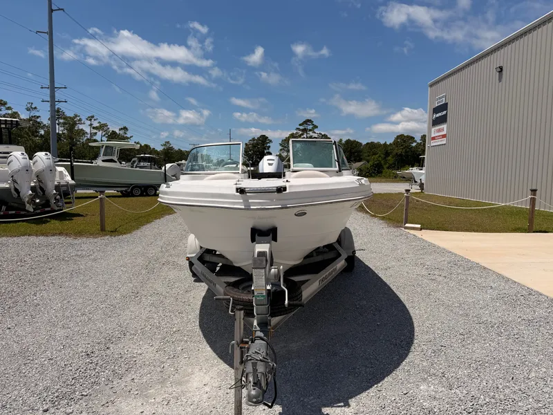 Slide: The Image of 2011 Triumph 191 FS boat on trailer outdoors. - 2