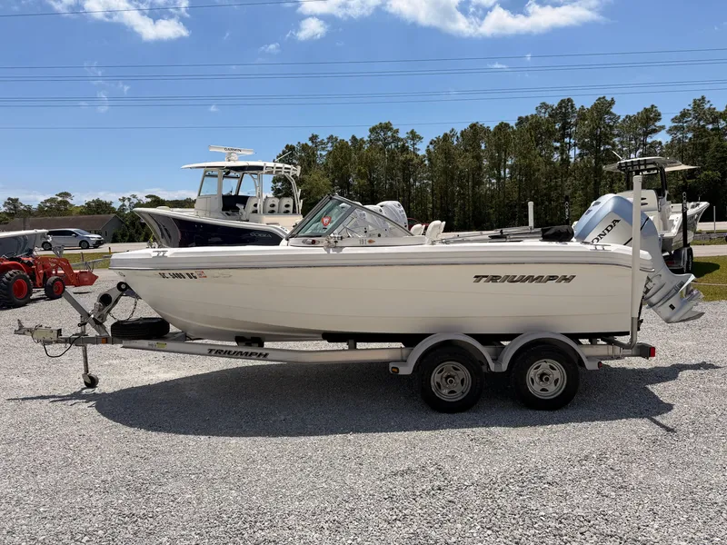 Slide: The Image of 2011 Triumph 191 FS boat on trailer, sunny day. - 4