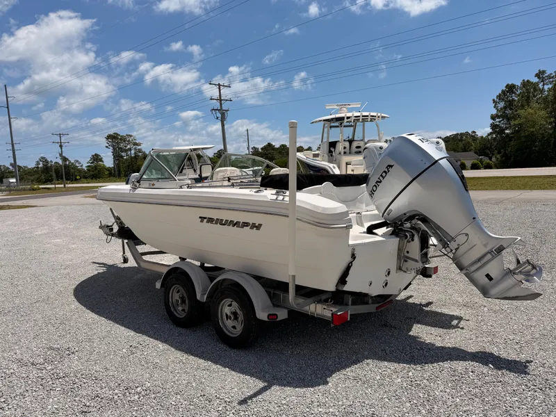 Slide: The Image of 2011 Triumph 191 FS boat with Honda outboard motor. - 5