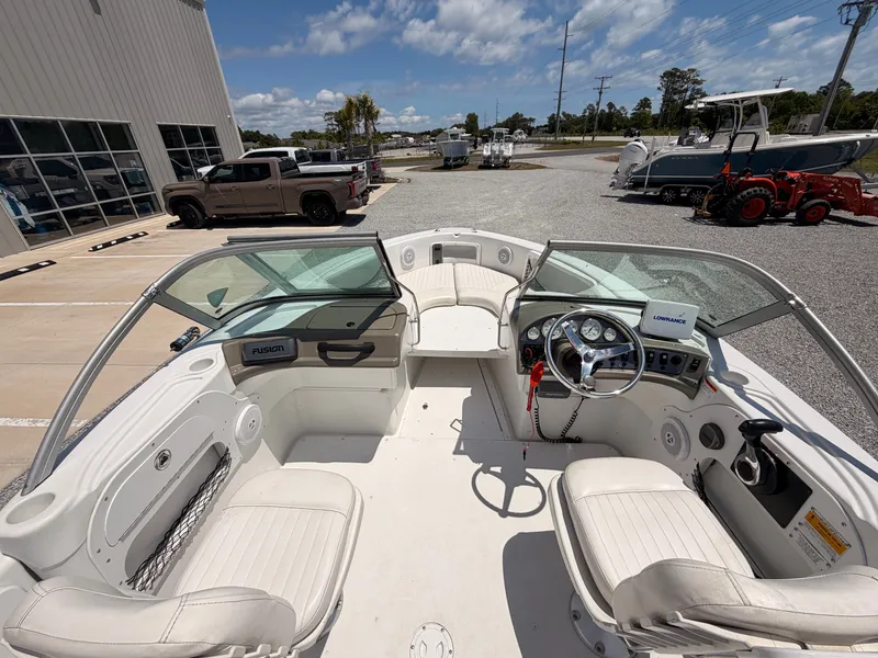 Slide: The Image of Interior view of a 2011 Triumph 191 FS boat on a parking lot. - 8
