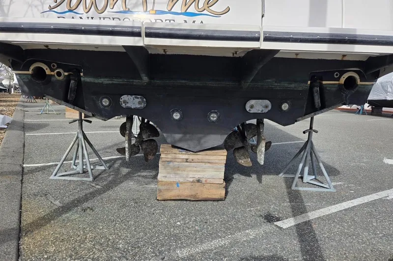 Slide: The Image of 2006 Tiara Yachts 3200 Open on stands, showing propellers and hull details. - 11