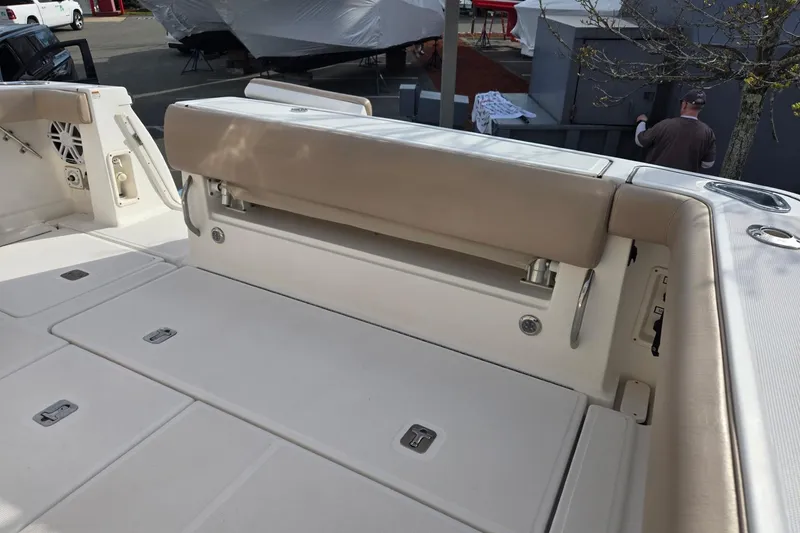 Slide: The Image of 2006 Tiara Yachts 3200 Open boat interior with beige seating and storage compartments. - 17