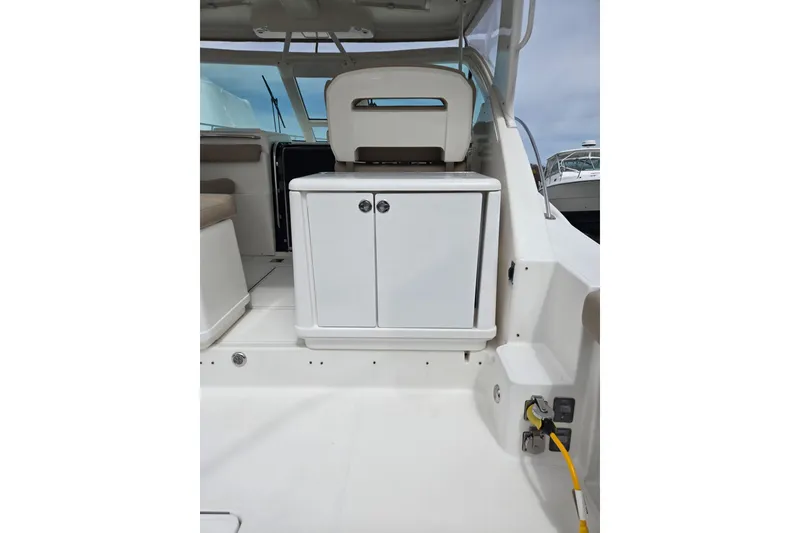 Slide: The Image of 2006 Tiara Yachts 3200 Open interior with white cabinetry and seating. - 27