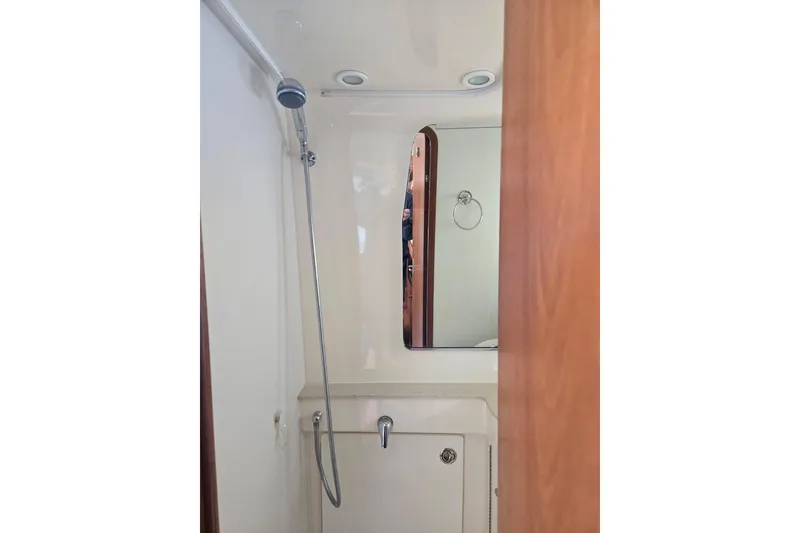 Slide: The Image of Bathroom interior of 2006 Tiara Yachts 3200 Open, featuring shower and mirror. - 29