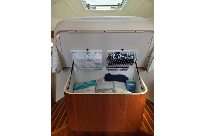 Slide: The Image of Interior storage space in a 2006 Tiara Yachts 3200 Open, featuring organized compartments. - 36