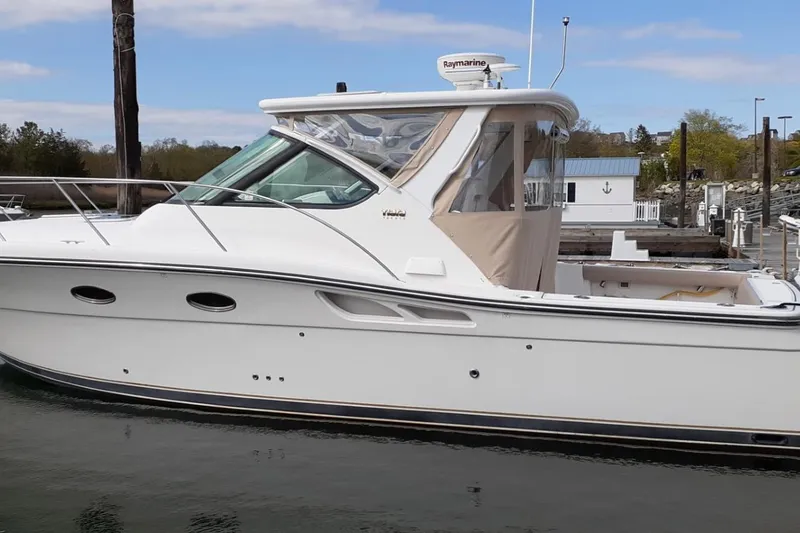 Slide: The Image of 2006 Tiara Yachts 3200 Open docked, showcasing sleek design and modern features. - 4