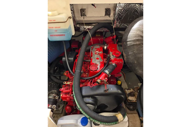 Slide: The Image of Engine compartment of a 2006 Tiara Yachts 3200 Open, featuring a Westerbeke engine. - 47