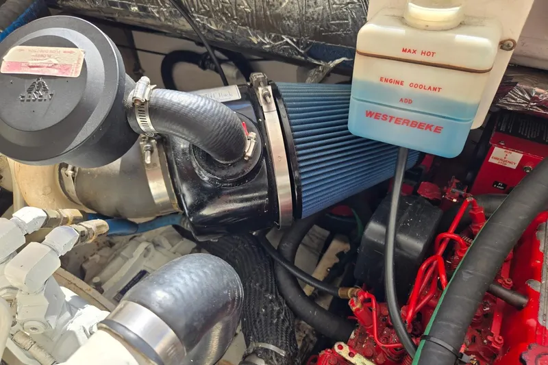 Slide: The Image of Engine compartment of a 2006 Tiara Yachts 3200 Open, featuring Westerbeke engine components. - 49