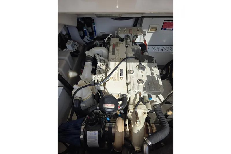Slide: The Image of Engine compartment of a 2006 Tiara Yachts 3200 Open, showcasing mechanical components. - 54