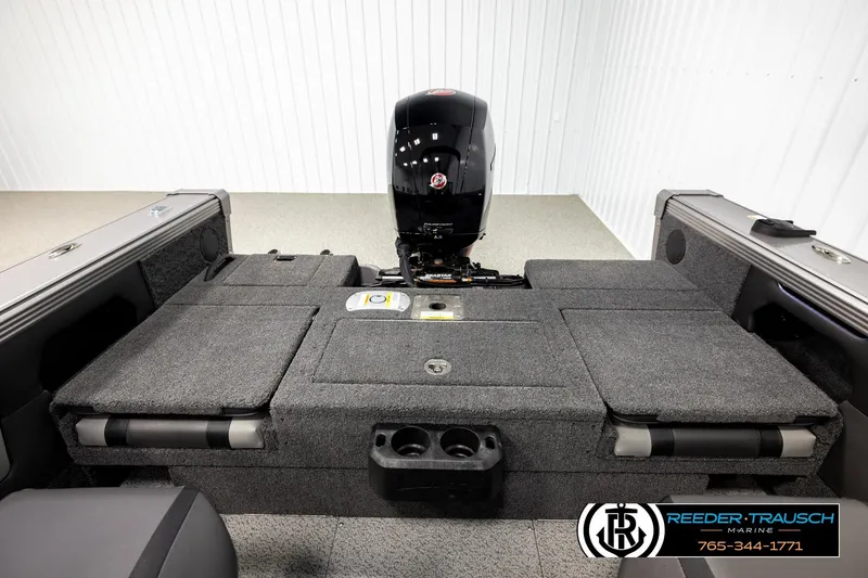 Slide: The Image of 2026 Lund 1875 Tyee boat interior with motor, featuring spacious seating and storage. - 19