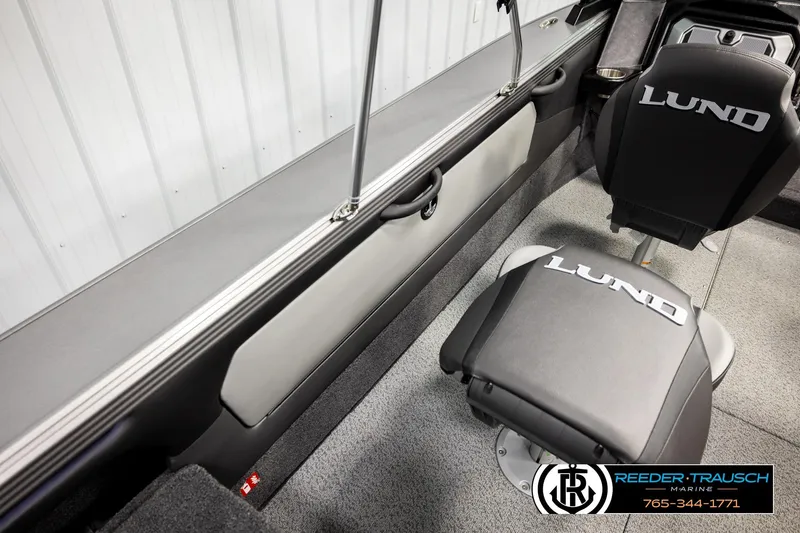 Slide: The Image of Interior of 2026 Lund 1875 Tyee boat with branded seating and sleek design. - 20