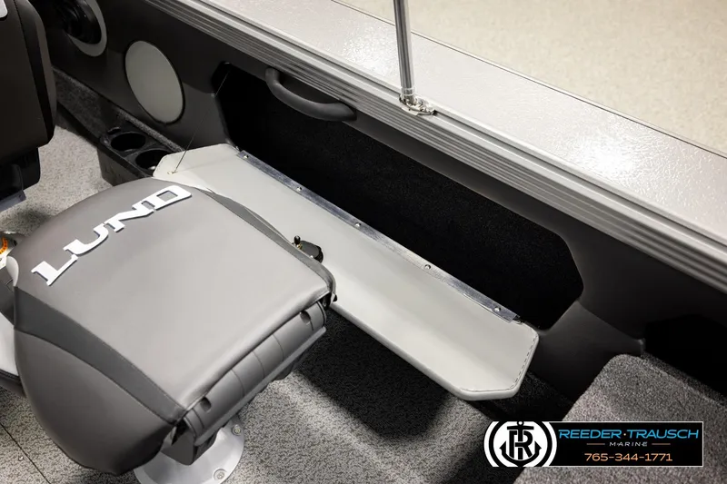 Slide: The Image of 2026 Lund 1875 Tyee boat interior with branded seat and storage compartment. - 23