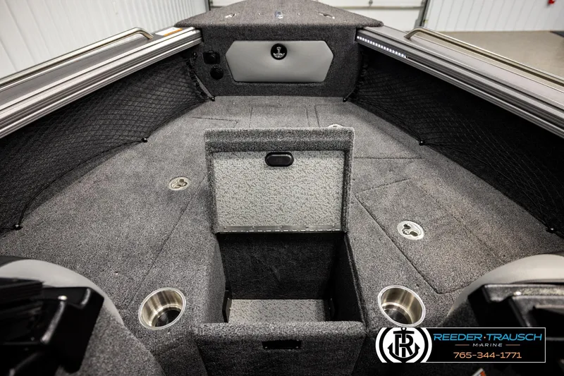 Slide: The Image of 2026 Lund 1875 Tyee boat interior with storage compartments and cup holders. - 27