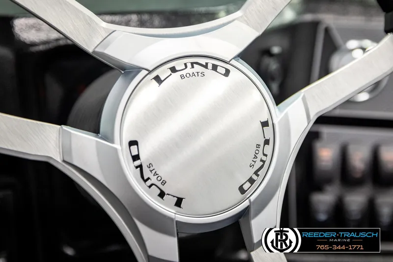 Slide: The Image of Steering wheel of 2026 Lund 1875 Tyee boat, featuring sleek metallic design. - 33