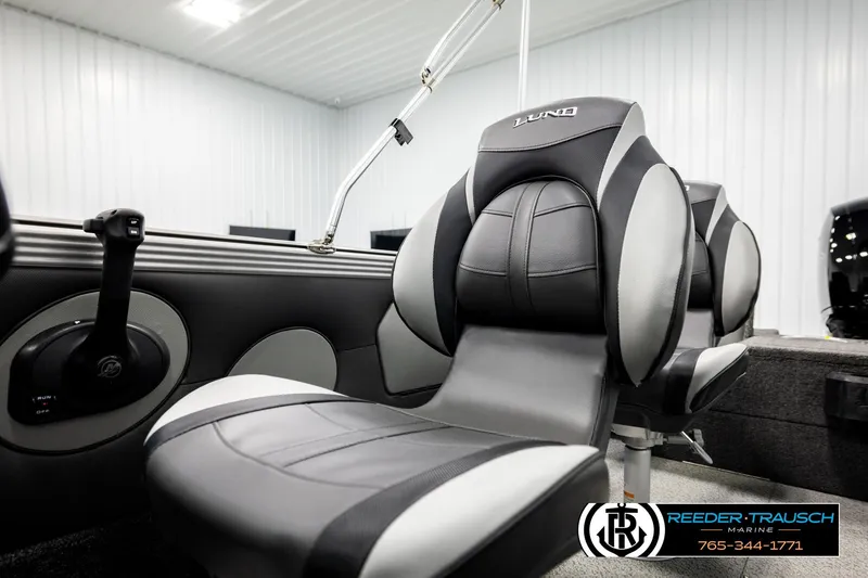 Slide: The Image of Interior of 2026 Lund 1875 Tyee boat with sleek black and gray seating. - 39