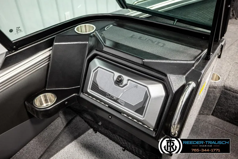 Slide: The Image of 2026 Lund 1875 Tyee boat interior with cup holders and storage compartment. - 41