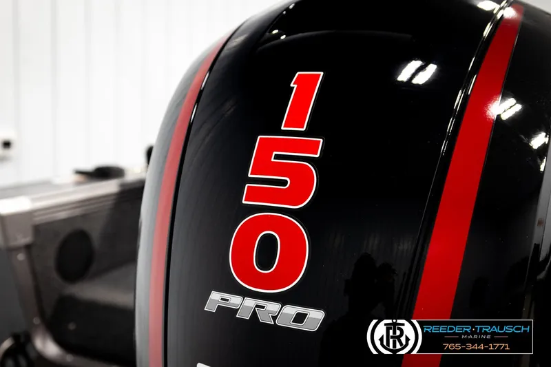 Slide: The Image of 2026 Lund 1875 Tyee boat engine with "150 Pro" branding and red stripes. - 48