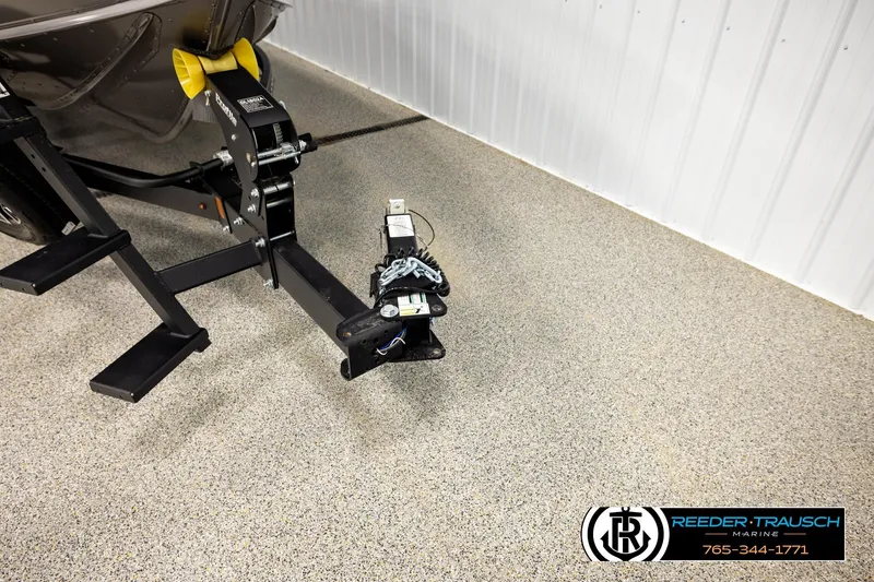 Slide: The Image of Trailer hitch of 2026 Lund 1875 Tyee boat in a showroom setting. - 50