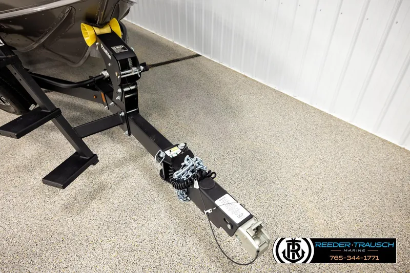 Slide: The Image of Trailer hitch of 2026 Lund 1875 Tyee boat in showroom, Reeder-Trausch Marine. - 51