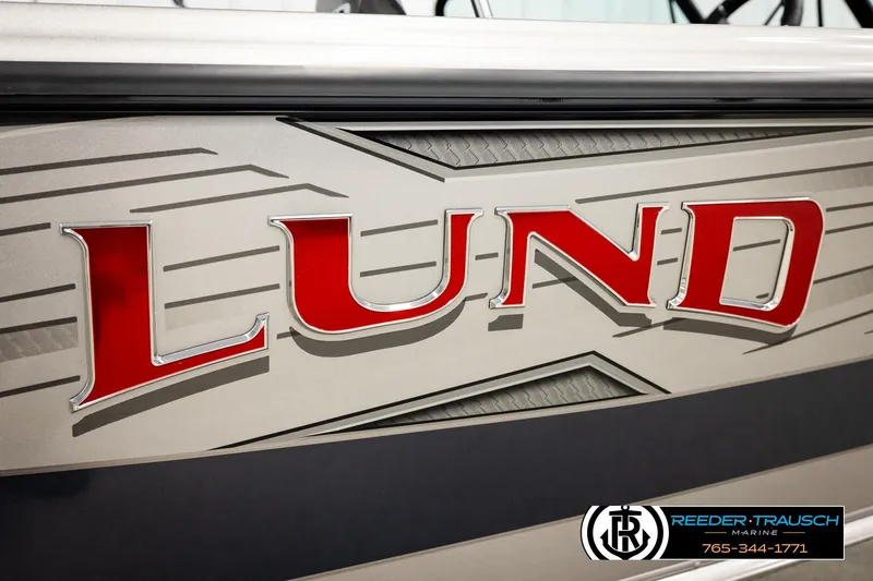 Slide: The Image of Close-up of 2026 Lund 1875 Tyee boat logo with sleek design. - 54