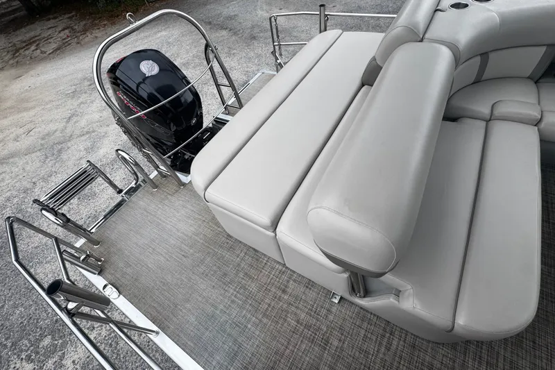 Slide: The Image of 2020 Harris Cruiser 210 pontoon boat with comfortable seating and outboard motor. - 5