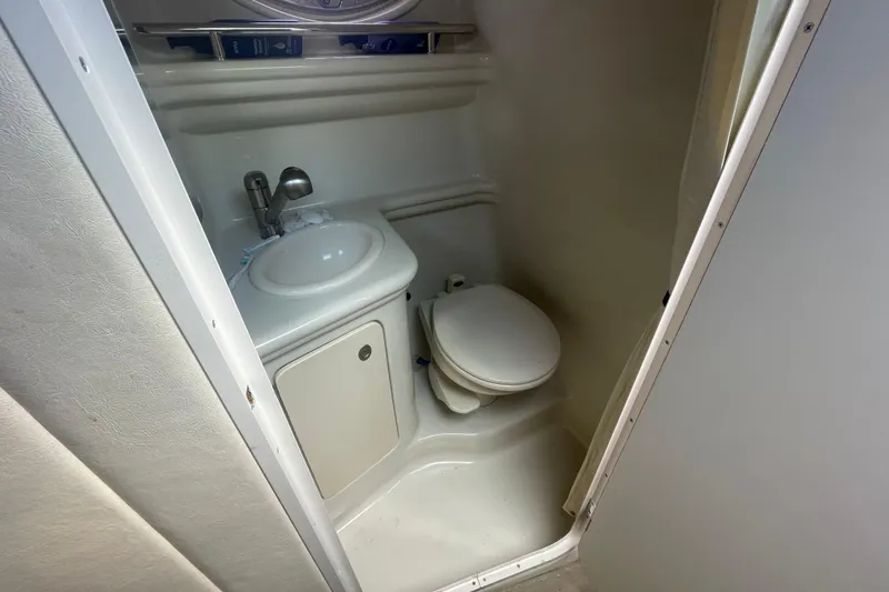 Slide: The Image of 2007 Sea Ray Sundancer 260 boat bathroom with sink and toilet. - 15