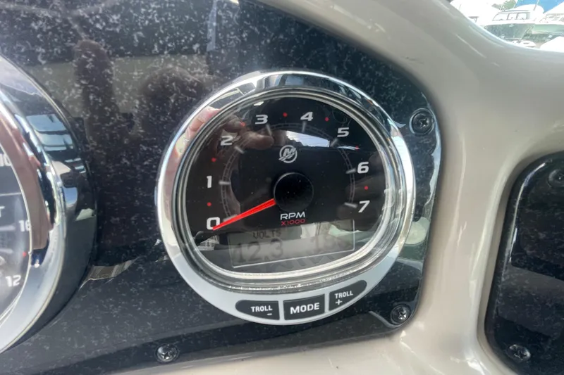 Slide: The Image of Close-up of 2007 Sea Ray Sundancer 260 tachometer displaying RPM and voltage. - 16